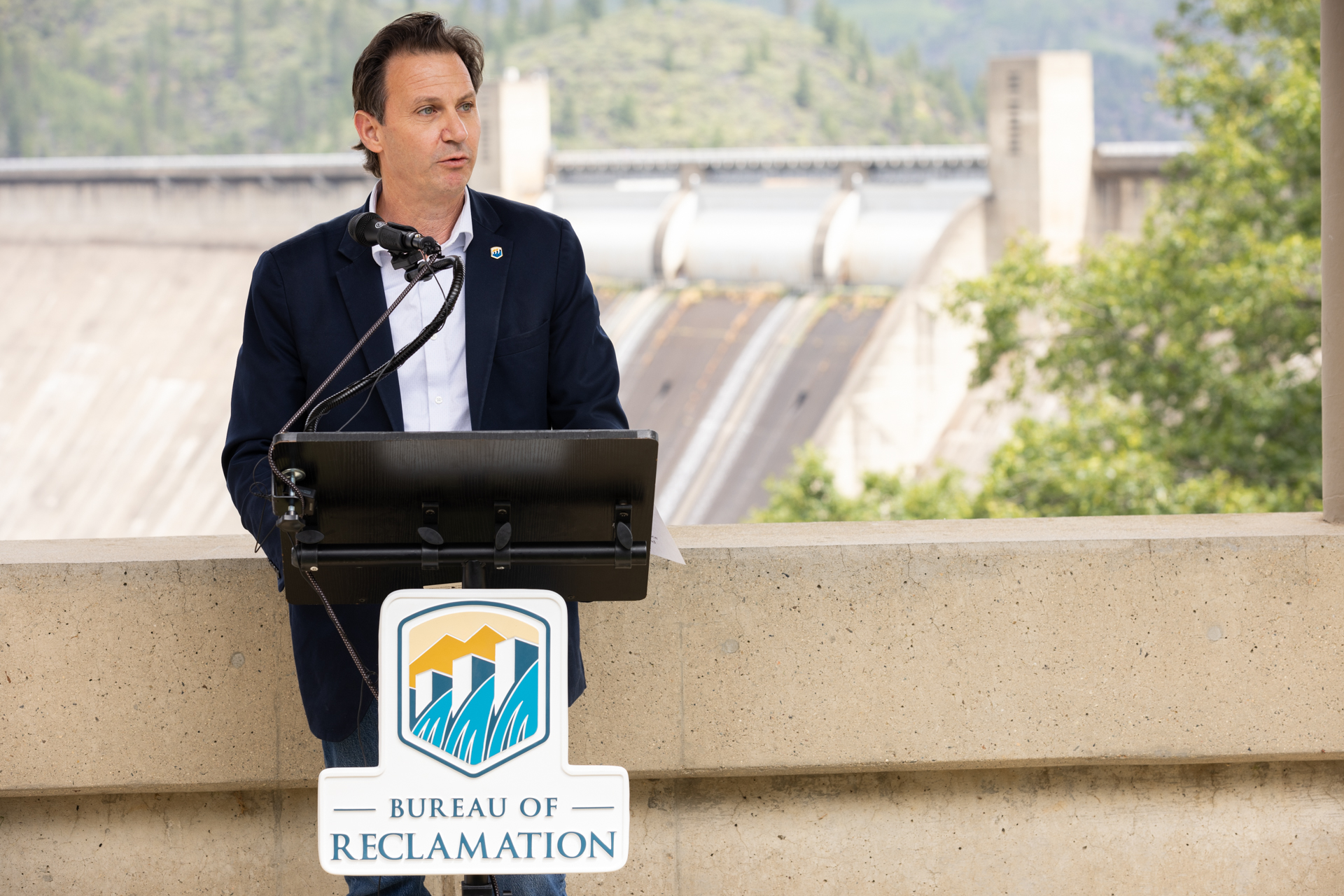 Acting commissioner of the Bureau of Reclamation, David Palumbo, speaks at Shasta Dam's 80th anniversary celebration.